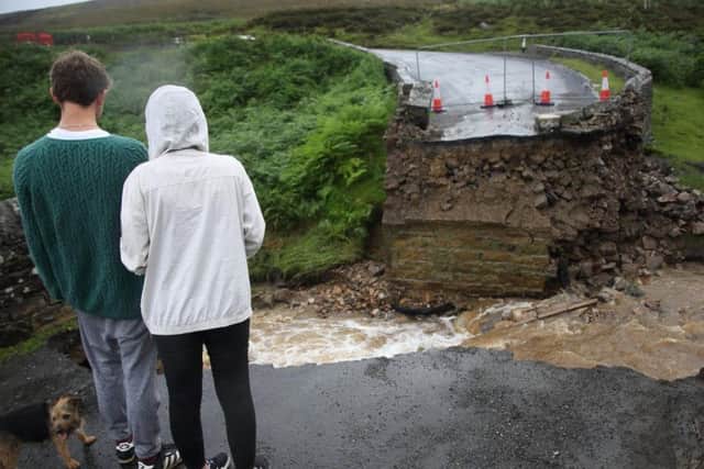 The collapsed bridge following heavy rainfall on Grinton moors, North Yorkshire. Pics: SWNS