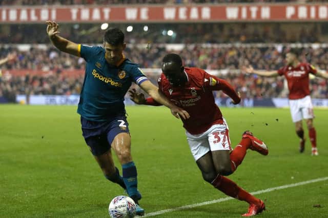 Nottingham Forest's Albert Adomah (right) and Hull City's Eric Lichaj battle for the ball at The City Ground. Picture: Nigel French/PA