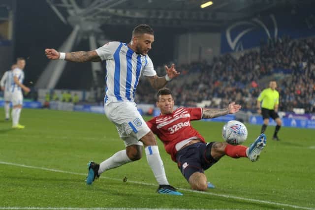 Huddersfield Town's Danny Simpson battles with Middlesbrough's Marvin Johnson. (Picture: Tony Johnson)