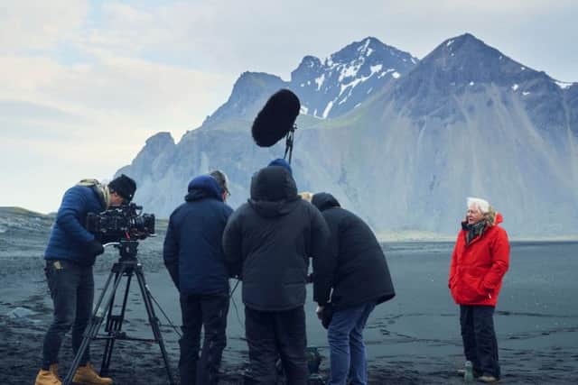 Sir David Attenborough filming for Seven Worlds, One Planet on windy Stokksnes beach in Iceland. Photo: PA Photo/BBC NHU/Alex Board.