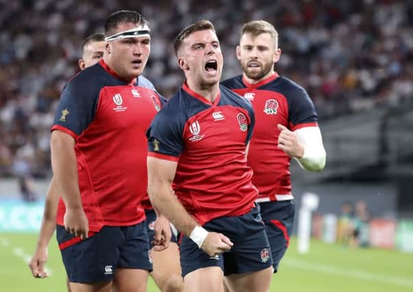 England's George Ford celebrates after scoring a try against Argentina in Tokyo. Picture: AP/Eugene Hoshiko