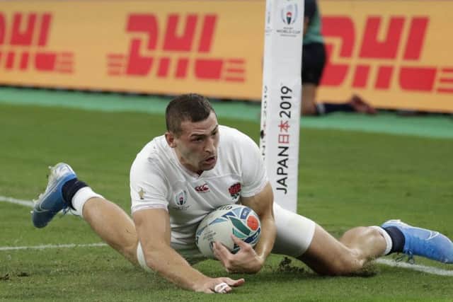 England's Jonny May scores a try in the World Cup quarter-final against  Australia in Oita. Picture: AP/Aaron Favila
