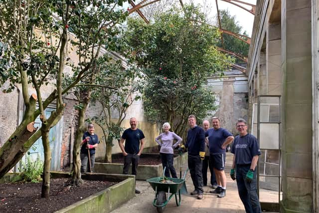 Wentworth gardeners with the 19 surviving camellias