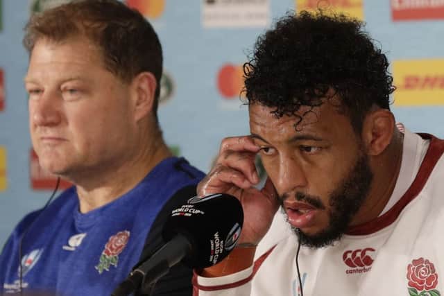 England rugby player Courtney Lawes, right, talks beside assistant coach Neal Hatley. (AP Photo/Aaron Favila)
