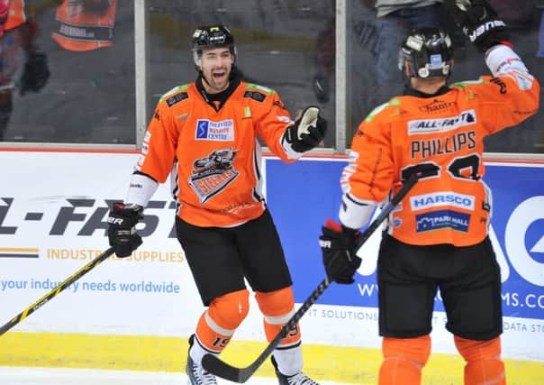 Rod Sarich celebrates a goal with Sheffield Steelers' team-mate and captain Jonathan Phillips against Dundee Stars in October 2014. Picture: Dean Woolley.