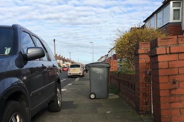 Councillors have been told new laws are needed to prevent drivers from parking on pavements