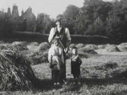The mansion can be seen in the background in this photo of Harry Downs and his son, the second and third of four generations to farm at Milner Field