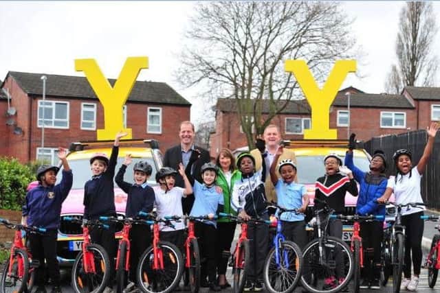 Welcome to Yorkshire Chief Executive Sir Gary Verity and Tour de France Director Christian Prudhomme in 2018 visiting the New Wortley Bike Library - a scheme supported by Yorkshire Bank as part of its Tour De Yorkshire sponsorship.