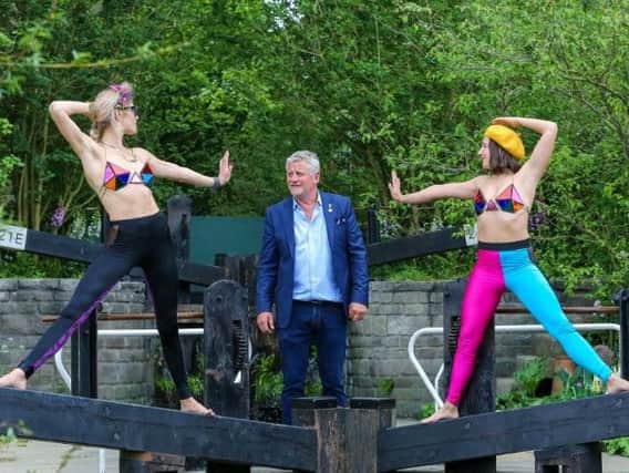 Two models seen with garden designer Mark Gregory within his "Welcome to Yorkshire Garden" during the 2019 Chelsea Flower Show. (Photo by Dinendra Haria/SOPA Images/LightRocket via Getty Images)