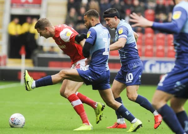 No way: Rotherham's Michael Smith is hounded off the ball.
