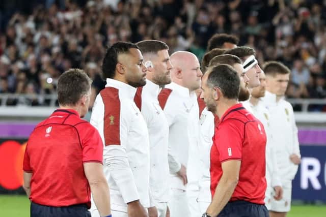 STAND OFF: Match Referee Nigel Owens tries to move the England team back as they face the haka prior to Saturday's World Cup semi-final at Stadium Yokohama. Picture: David Rogers/Getty Images.