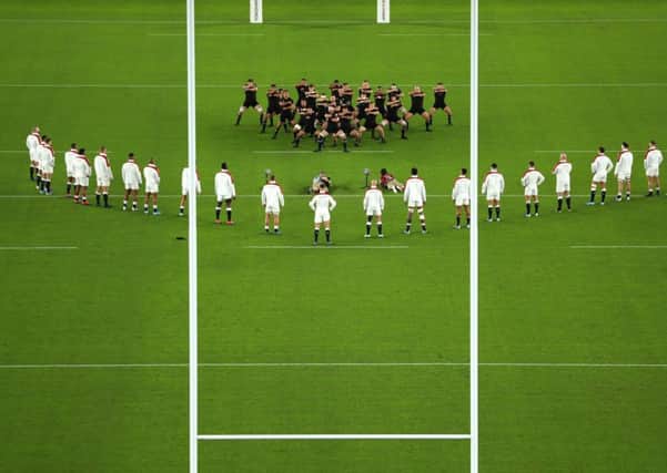 ENVELOPE: England players look on while New Zealand players perform a haka at Stadium Yokohama. Picture: Dan Mullan/Getty Images