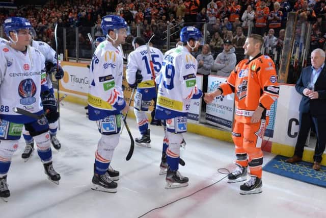 Coventry Blaze player line up to congratulate Jonathan Phillips at Ice Sheffield on Saturday night. Picture: Dean Woolley.