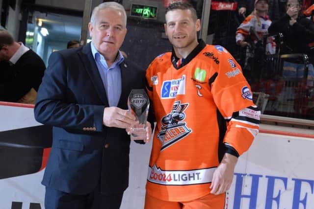 Sheffield Steelers' owner Tony Smith presents a gift to Jonathan phillips for 1,000 Elite league games. Picture courtesy of Dean Woolley.