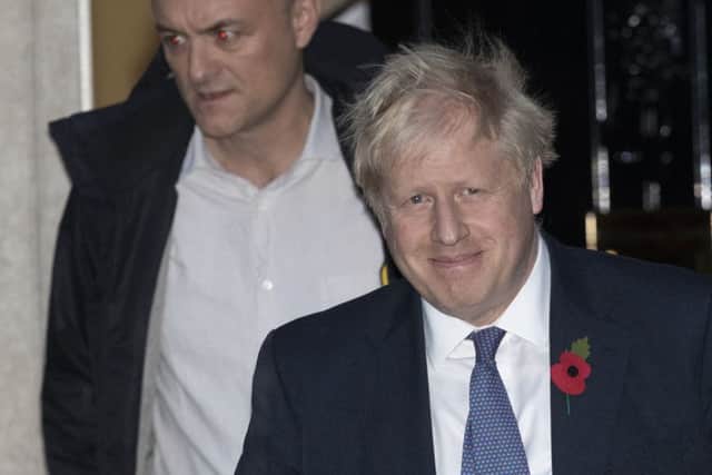 Boris Johnson and his chief strategist Dominic Cummings leave 10 Downing Street.
