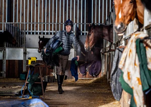 Back to work: Adam Nicol at 
Phil Kirby's racing stables. Picture: James Hardisty