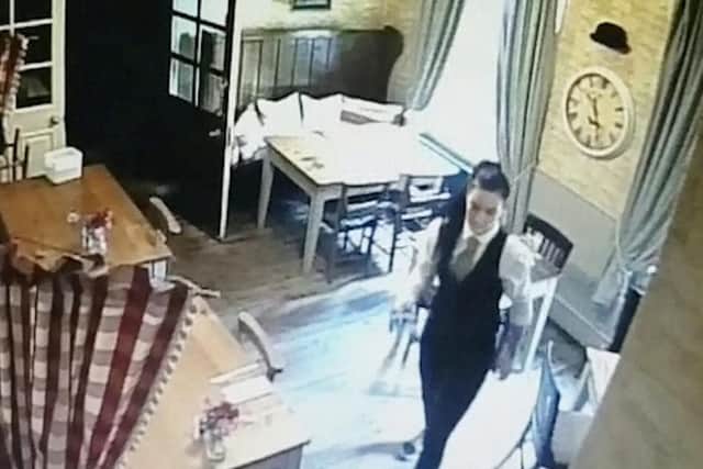 A waitress called Molly was clearing tables when the 'ghost' appeared
