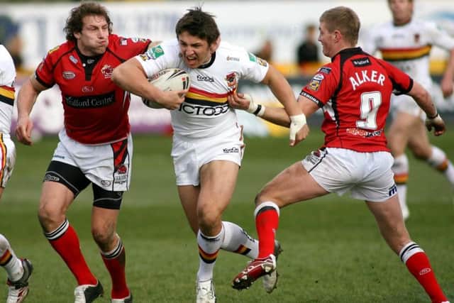 Bradford Bulls' Sam Burgess (cente) breaks between Salford City Reds's Andy Coley (left) and Malcolm Alker during the engage Super League match at Odsal in March 2007. Picture: Gareth Copley/PA