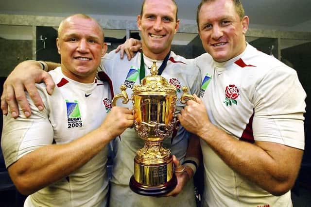 HEROES: England's Neil Back (left), Lawrence Dallaglio and Richard Hill (right) pose with the William Webb Ellis World Cup trophy back in 2003