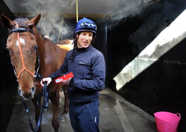 Jockey Danny Cook with Definitly Red at Brian Ellison's stables.