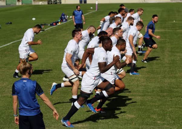 The England forwards sprint during the captain's run at the Fuchu Assahi Football Park. (Photo by David Rogers/Getty Images)