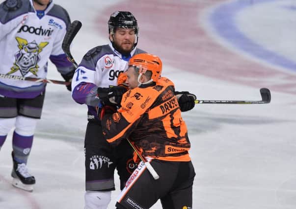 Sheffield Steelers' Michael Davies, right, comes to blowswith manchester's Mathieu Gagnon on Wednesday night. Both have received lengthy bans. Picture: Dean Woolley.