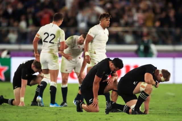 MOMENT OF TRUTH: New Zealand players slump to their knees after losing the World Cup semi-final against England. Picture: Adam Davy/PA