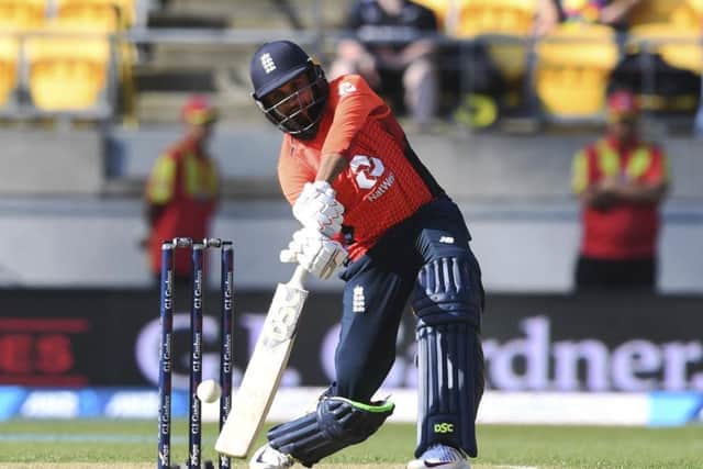 England's Adil Rashid throws the bat but it was all in vain in a 21-run defeat to New Zealand in Wellington. Picture: AP/Ross Setford.
