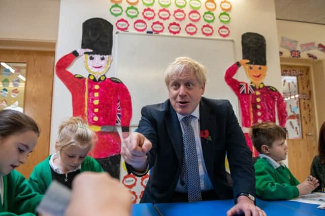 Boris Johnson during a school visit as the election campaign begins.