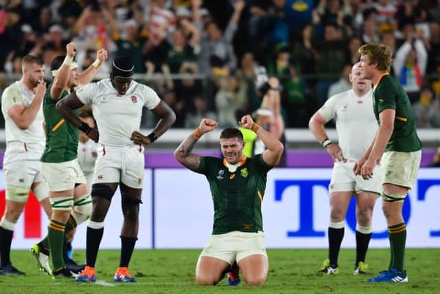 THE MOMENT: England's players show their despair as South Africa's players start to celebrate at the final whistle of Saturday's World Cup Final at Yokohama Stadium. Picture: Ashley Western/PA