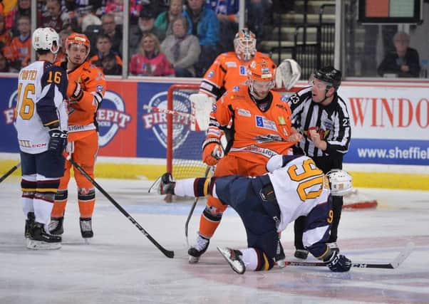 UP CLOSE AND PERSONAL: Sheffield Steelers' Robert Dowd has a disagreement with Guildford's John Dunbar.Picture Courtesy of Dean Woolley.