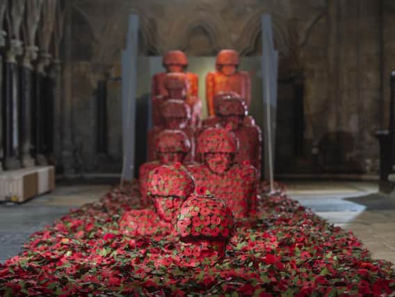 he Martin Water's War memorial art installation at Beverley Minster in Beverley, East Yorkshire. The poppy installation is created in rememberance of all those who died in the Battle of Normandy, France in 1944 and the fate that awaited them as they disembarked the landing craft. Credit: Dan Rowlands / SWNS.com