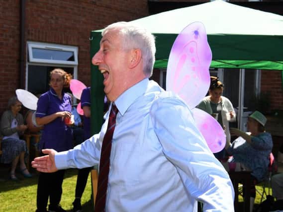 Sir Lindsay Hoyle MP getting his wings as a butterfly at the Butterfly Garden Party at Coniston House Care Home, Chorley