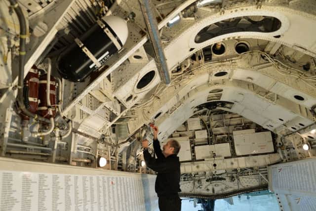 An airframe technician or 'rigger', working inside the bomb bay of the last flying Vulcan bomber XH558