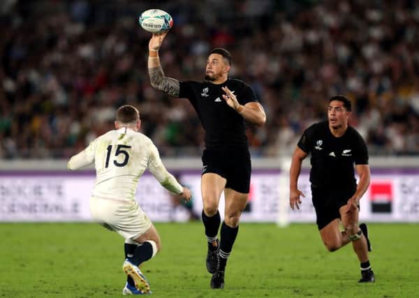 Legend: New Zealand's Sonny Bill Williams passes the ball during the 2019 Rugby World Cup semi-final against England.