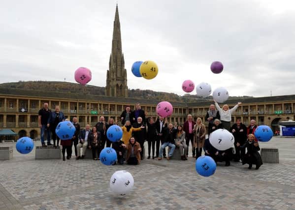 Lottery winners celebrate on the National Lottery 25th anniversary at the Piece Hall, Halifax. Picture by Simon Hulme
