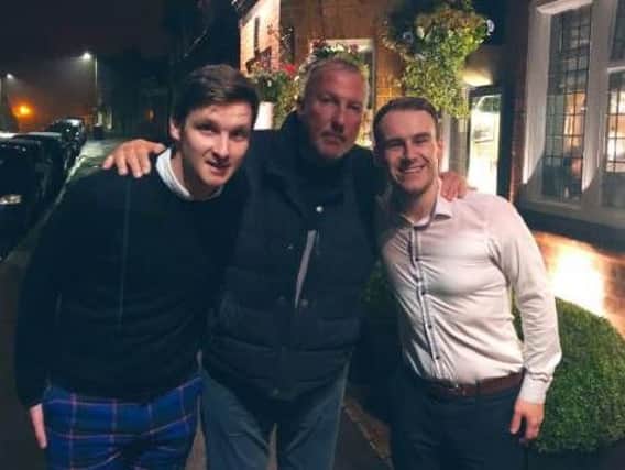 Sir Ian 'Beefy' Botham with staff at The Plough in Scalby