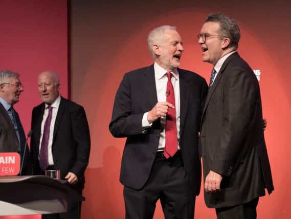 Labour leader Jeremy Corbyn is pictured with deputy leader Tom Watson who today announced his resignation.