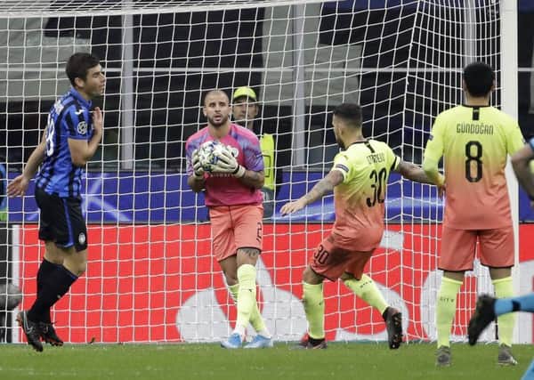 Manchester City's Kyle Walker, second from left, is playing as goalkeeper during the Champions League group C soccer match between Atalanta and Manchester City at the San Siro stadium in Milan. (AP Photo/Luca Bruno)
