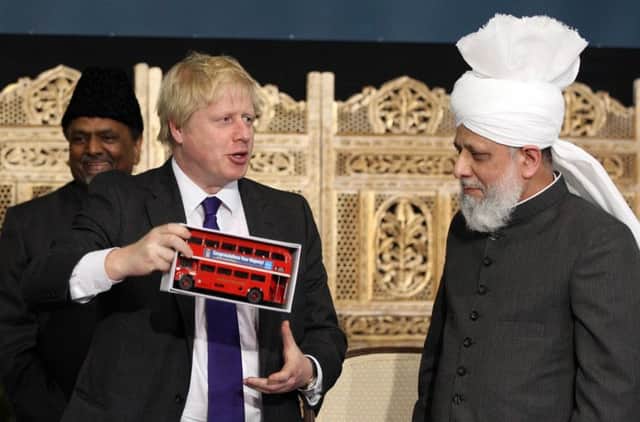 Boris Johnson meets worshippers as he visits Europe's biggest mosque, the Baitul Futuh Mosque, in Morden, Surrey, to hear how Muslims are countering extremism during the National Peace Symposium on International Peace organised by the Ahmadiyya Muslim community in 2012.  Picture: Lewis Whyld/PA Wire