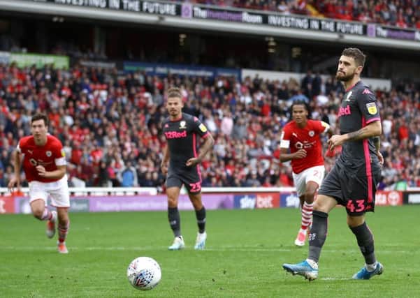 Leeds United's Mateusz Klich scores his side's second goal at Barnsley.