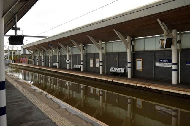 Flood water covers the rail tracks at Rotherham Central train station. Photo by Oli Scarff  / AFP via Getty Images.