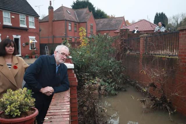 Labour leader Jeremy Corbyn and Labour MP Caroline Flint during a visit to Conisborough, South Yorkshire, where he met residents affected by flooding. Picture: Danny Lawson/PA Wire
