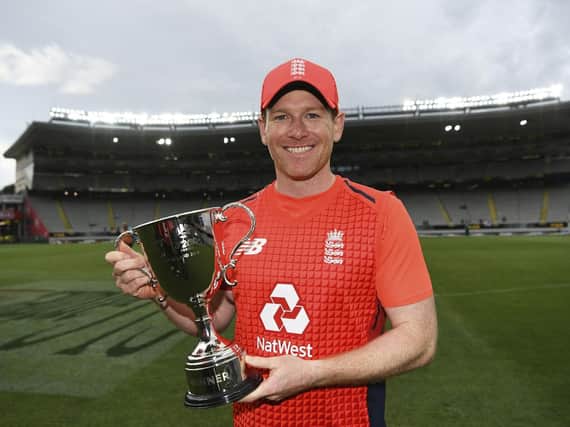 It's ours: England captain Eoin  Morgan with the trophy.