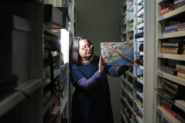 The Festival of Britain collection at Sheffield Hallam University. Pictured is archivist Heidi Sidwell with a Festival of Britain jigsaw. Picture: Chris Etchells
