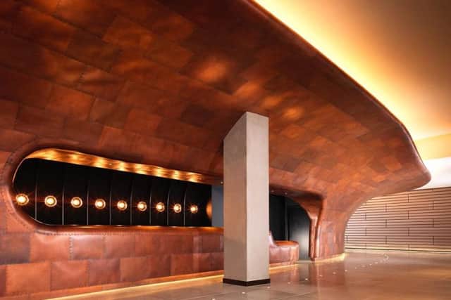 The reception and lobby  is dominating by an impressive copper hull design feature
