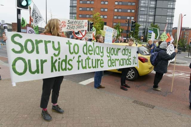 Climate protestors, Extinction Rebellion block Derek Dooley Way in Sheffield at Bridgehouse Roundabout to disrupt the morning rush hour traffic flow into the city