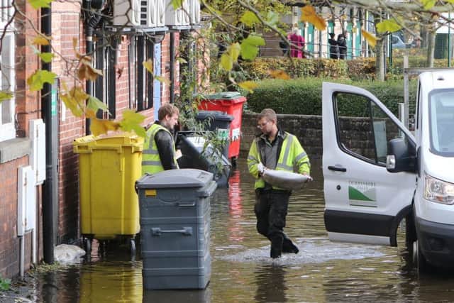 Sandbags are delivered to flood-hit homes as Environment Secretary Theresa Villiers praises the rescue operation.