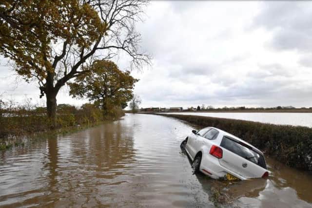 A car sits in flood water in the town of Fishlake near Doncaster after the river Don burst its banks. Picture: Anthony Devlin/Getty