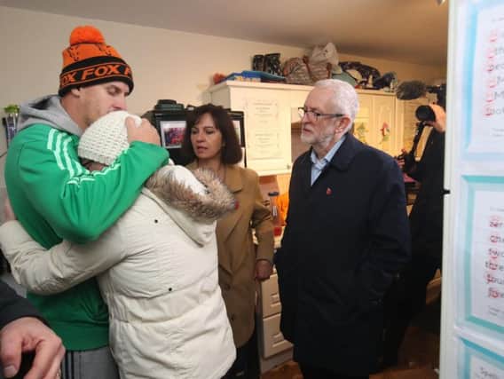Labour leader Jeremy Corbyn and Labour MP Caroline Flint during a visit to Conisborough, South Yorkshire, meeting residents James and Alison Merritt (left and centre left), in their house which was affected by flooding. Photo: Danny Lawson/PA Wire